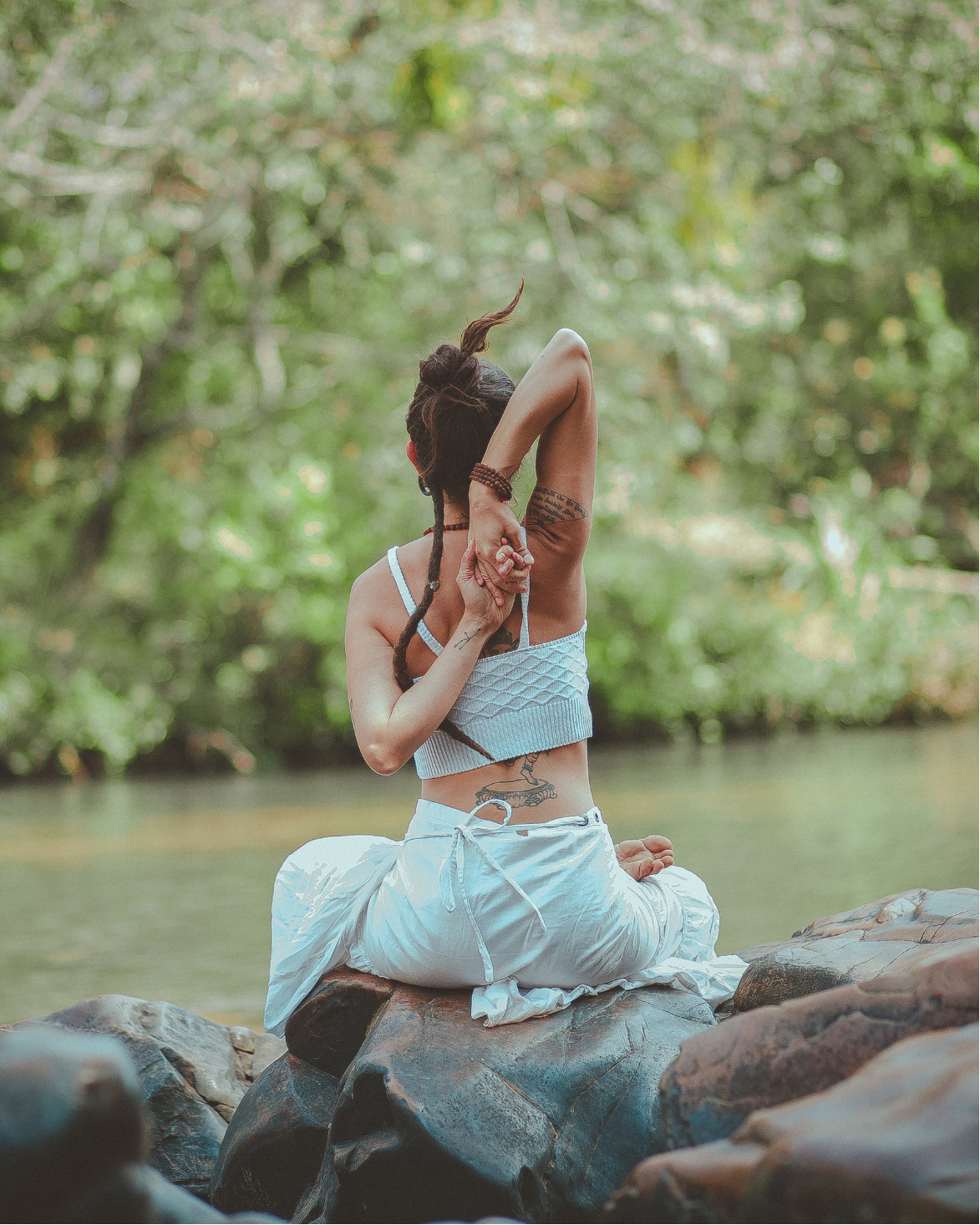 Woman doing cow face pose yoga